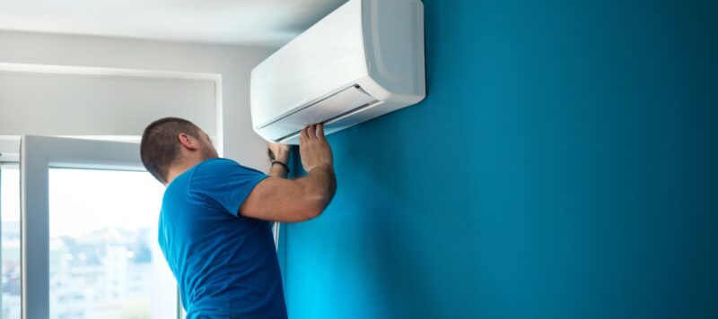 ductless ac unit being installed in a home